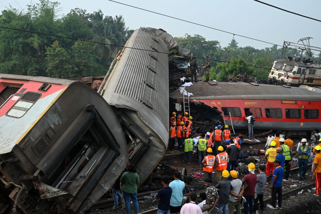 Odisha train crash in PICS: Locomotive sits atop goods wagon; tireless rescue operations...