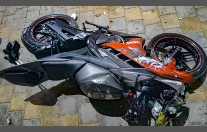A motorcycle damaged after a mob attacked a hostel in a university in Gujarat, India, where foreign students were offering namaz
