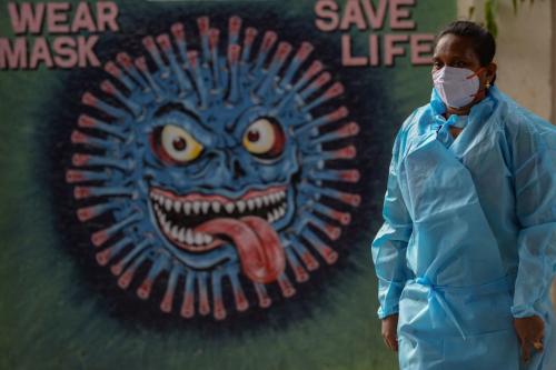 Health workers wear personal protective equipment (PPE) as they prepare to perform Covid-19 coronavirus screening at a railway station in Chennai, Tamil Nadu, on August 5, 2021. (Photo by ARUN SANKAR/AFP via Getty Images)